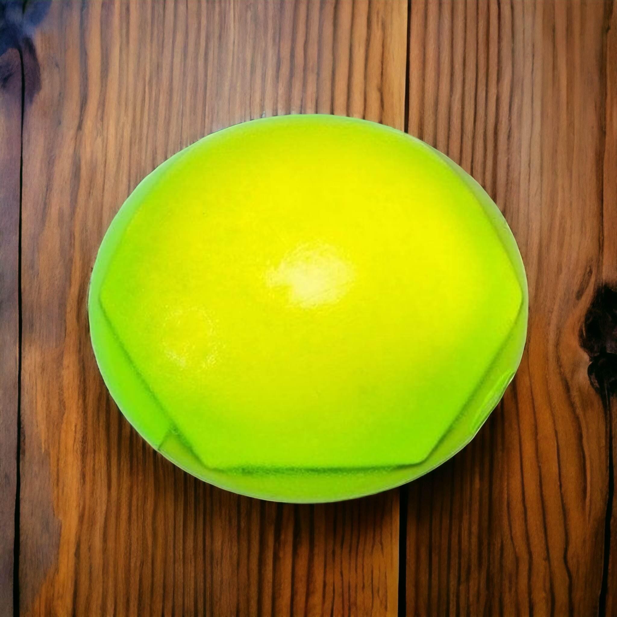 A small green geometric shaped resin dome.