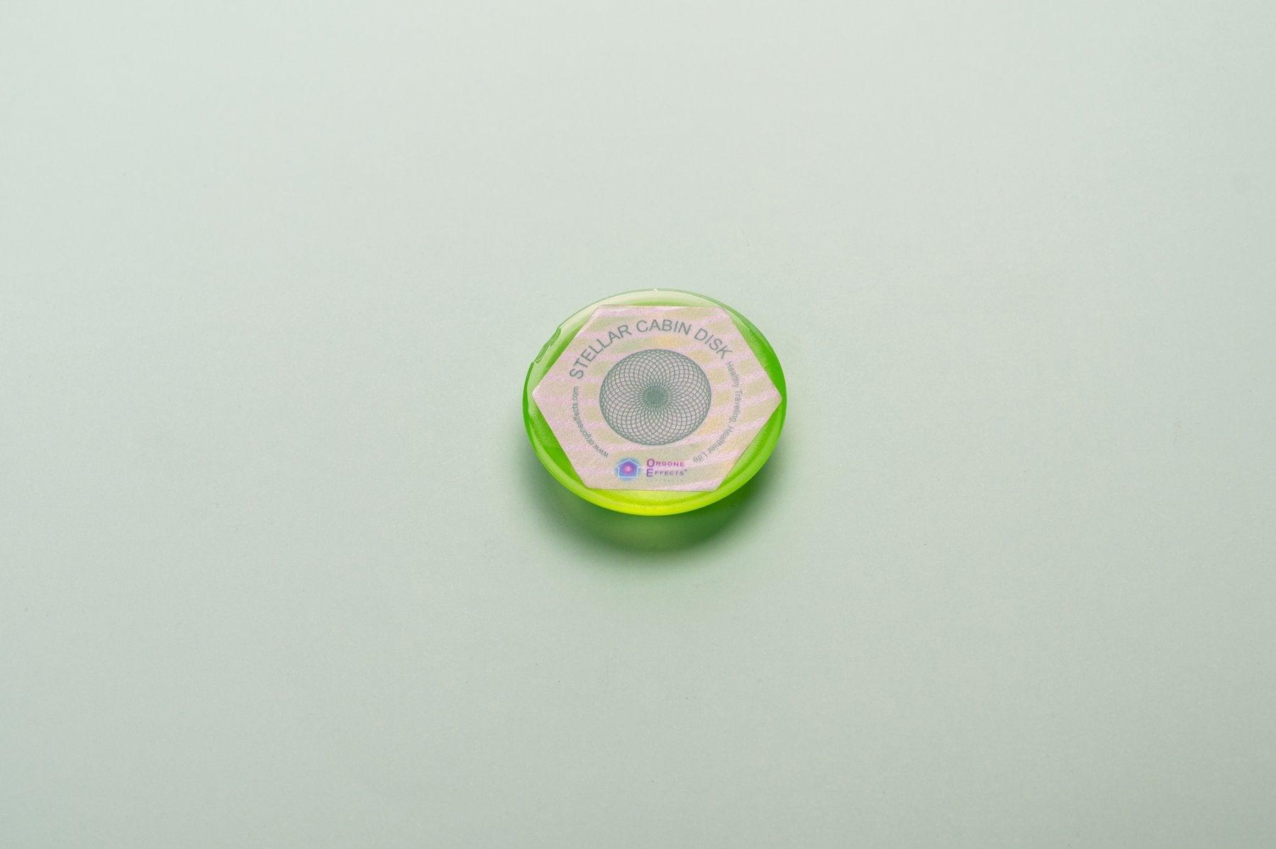 A small green geometric shaped resin dome.