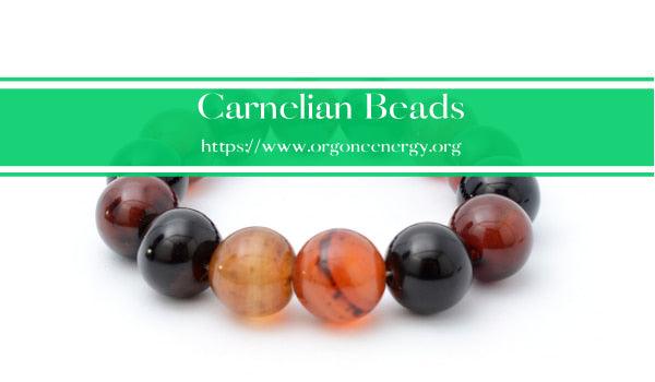 Carnelian beads, a type of semi-precious stone that is known for its orange-red color and its ability to promote creativity, confidence, and self-esteem