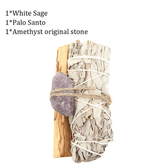 A natural wood support holding up an abalone shell with a sage stick with a feather placed beside
